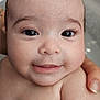 Amélie participe au concours pour gagner de l'argent avec cette photo : adorable, arm, baby, child, closeup, cute, expression, eyes, face, fresh, hand, human, infant, newborn, person, portrait, skin, smile, water, wet