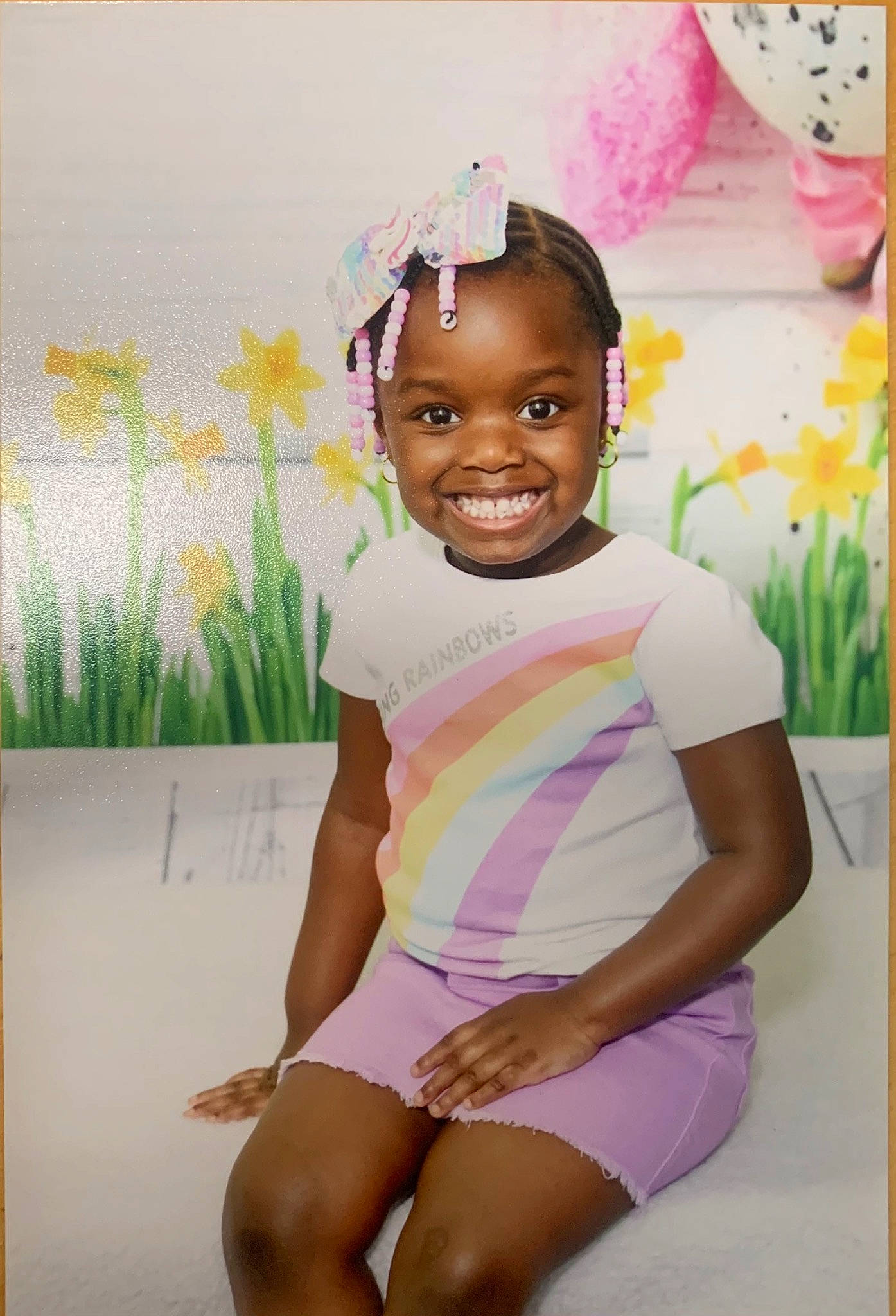 Annah is registered to the contest to win money with this photo: baby_toddler_clothing, black_hair, facial_expression, hairstyle, happy, head, joy, knee, neck, organ, people_in_nature, person, pink, plant, shorts, skin, sleeve, smile, standing, t_shirt