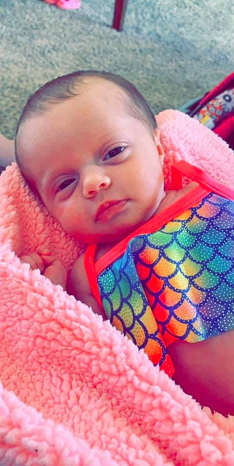 Danica is registered to the contest to win money with this photo: baby, cheek, child, close_up, eye, face, head, iris, lip, mouth, nose, person, pink, skin, smile, textile, toddler