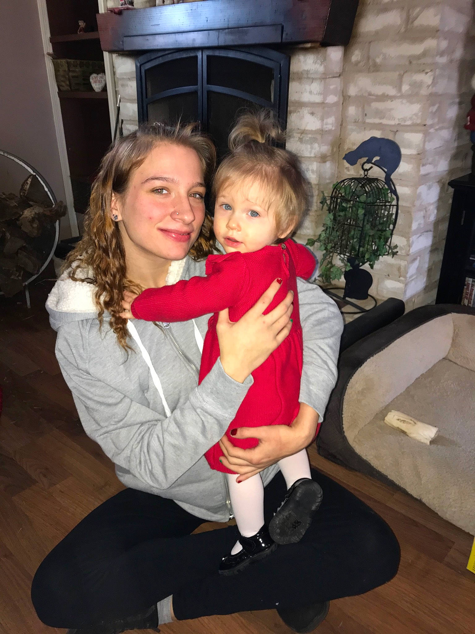 Sarena is registered to the contest to win money with this photo: child, daughter, fun, joy, lap, leg, person, smile, standing, toddler