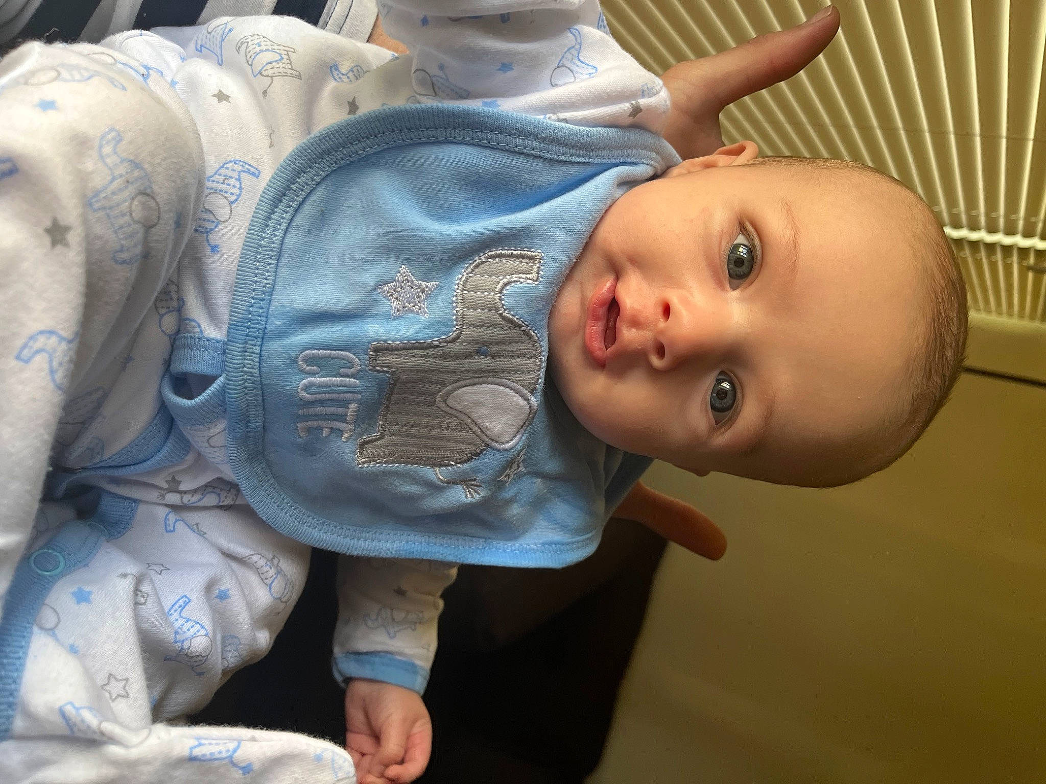 Lucas is registered to the contest to win money with this photo: arm, baby, baby_toddler_clothing, cheek, chest, eye, eyelash, face, hand, head, headgear, human_body, iris, joint, lip, mouth, nose, person, skin, thigh