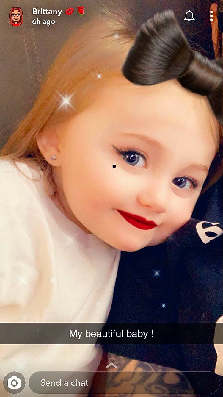 Arionna is registered to the contest to win money with this photo: bangs, black_hair, brown_hair, cheek, child, doll, eye, eyebrow, eyelash, fashion_accessory, flash_photography, happy, headpiece, iris, lip, nose, person, skin, smile, toddler