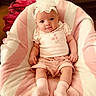 baby, infant, child, headband, flower, pink, blanket, clothing, socks, cute, portrait, indoor, soft, smiling, person, toddler, seated, comfortable, adorable, young