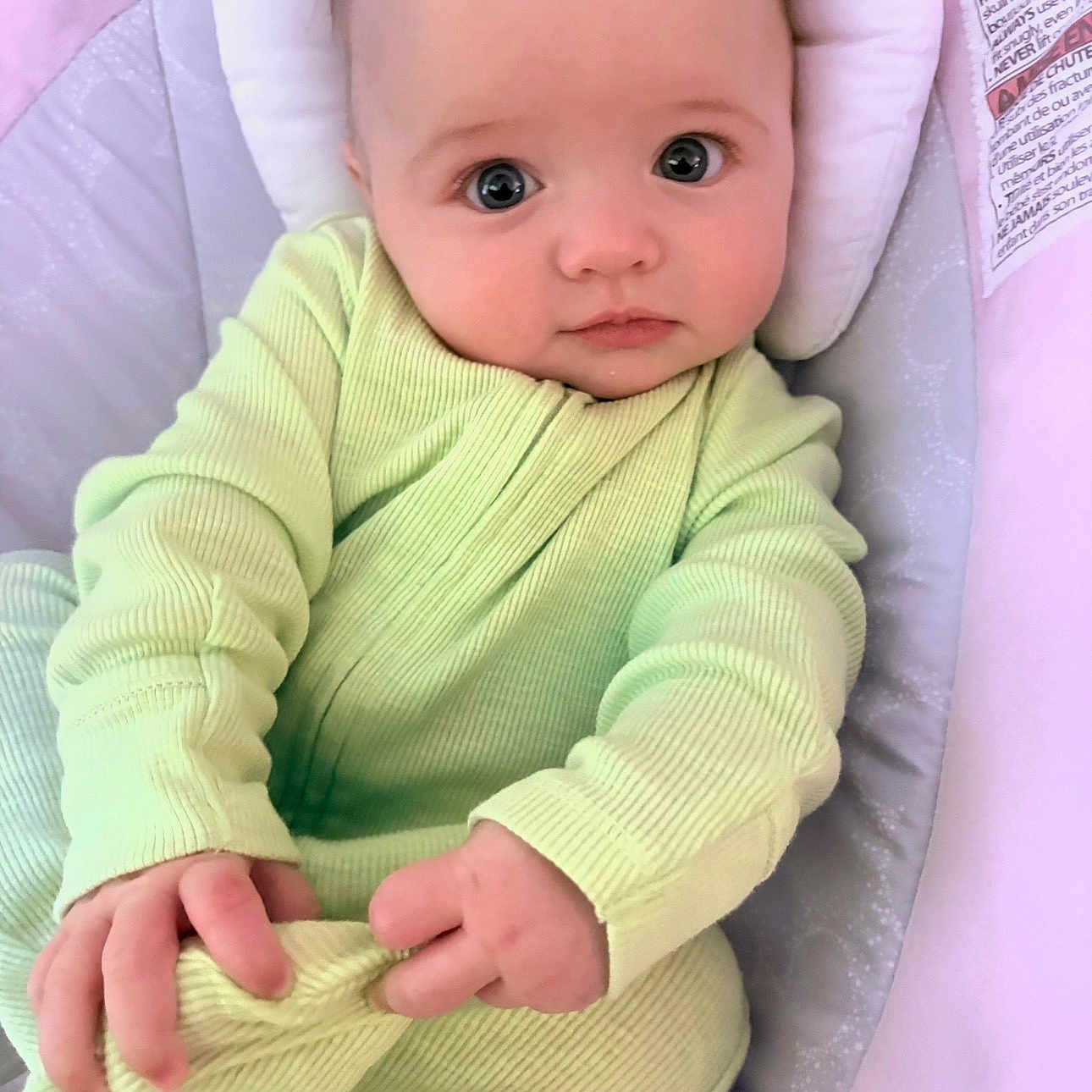 Braelynn joined the competition — help win amazing prizes! baby, infant, child, onesie, green_clothing, hand, foot, face, eyes, cushion, baby_seat, portrait, cute, indoor, skin, expression, newborn, small_hands, looking, comfortable