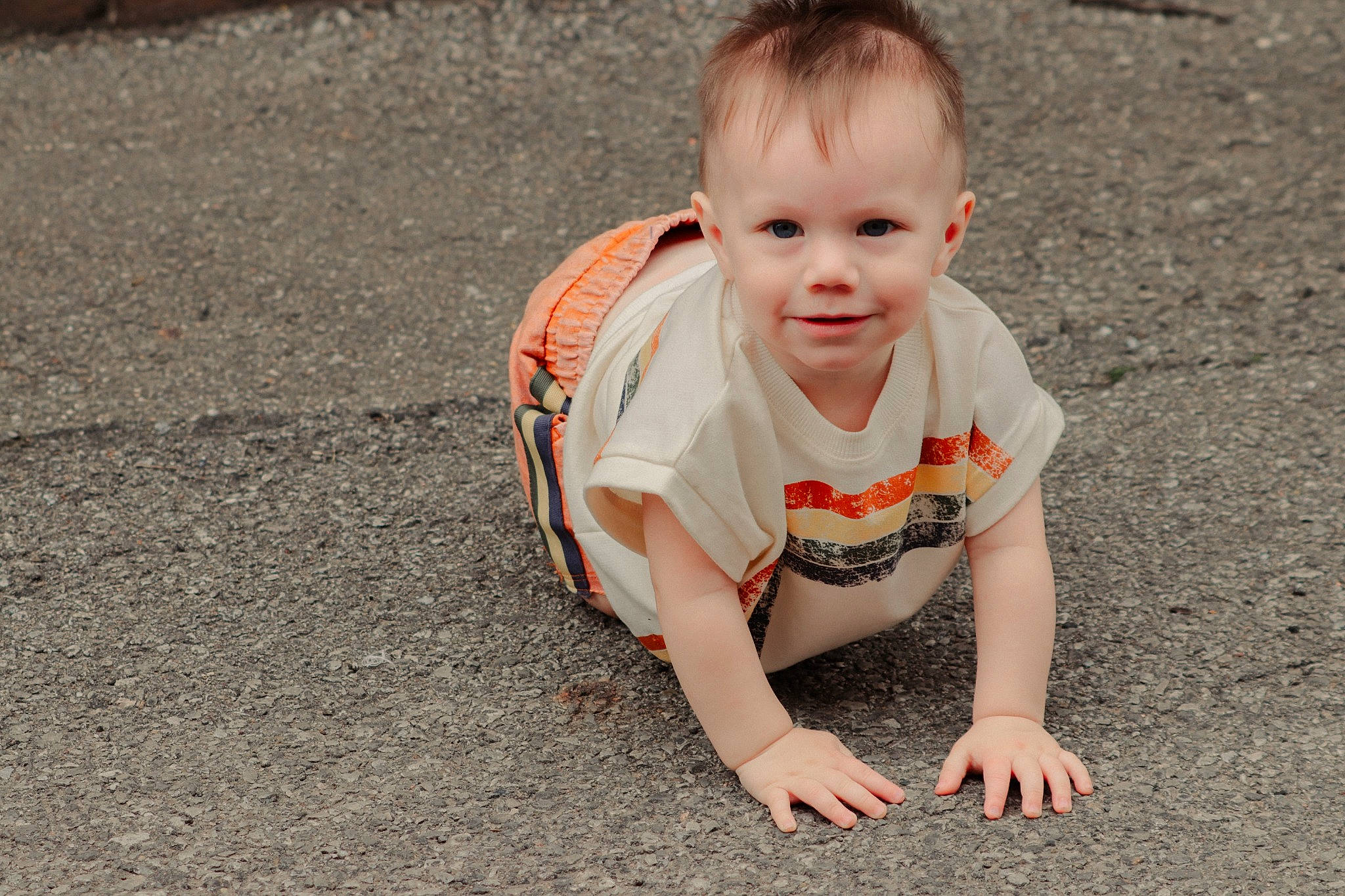 Maverick is registered to the contest to win money with this photo: asphalt, baby, baby_toddler_clothing, child, crawling, flooring, fun, grass, happy, joy, people_in_nature, person, plant, road_surface, sitting, skin, smile, soil, t_shirt, toddler