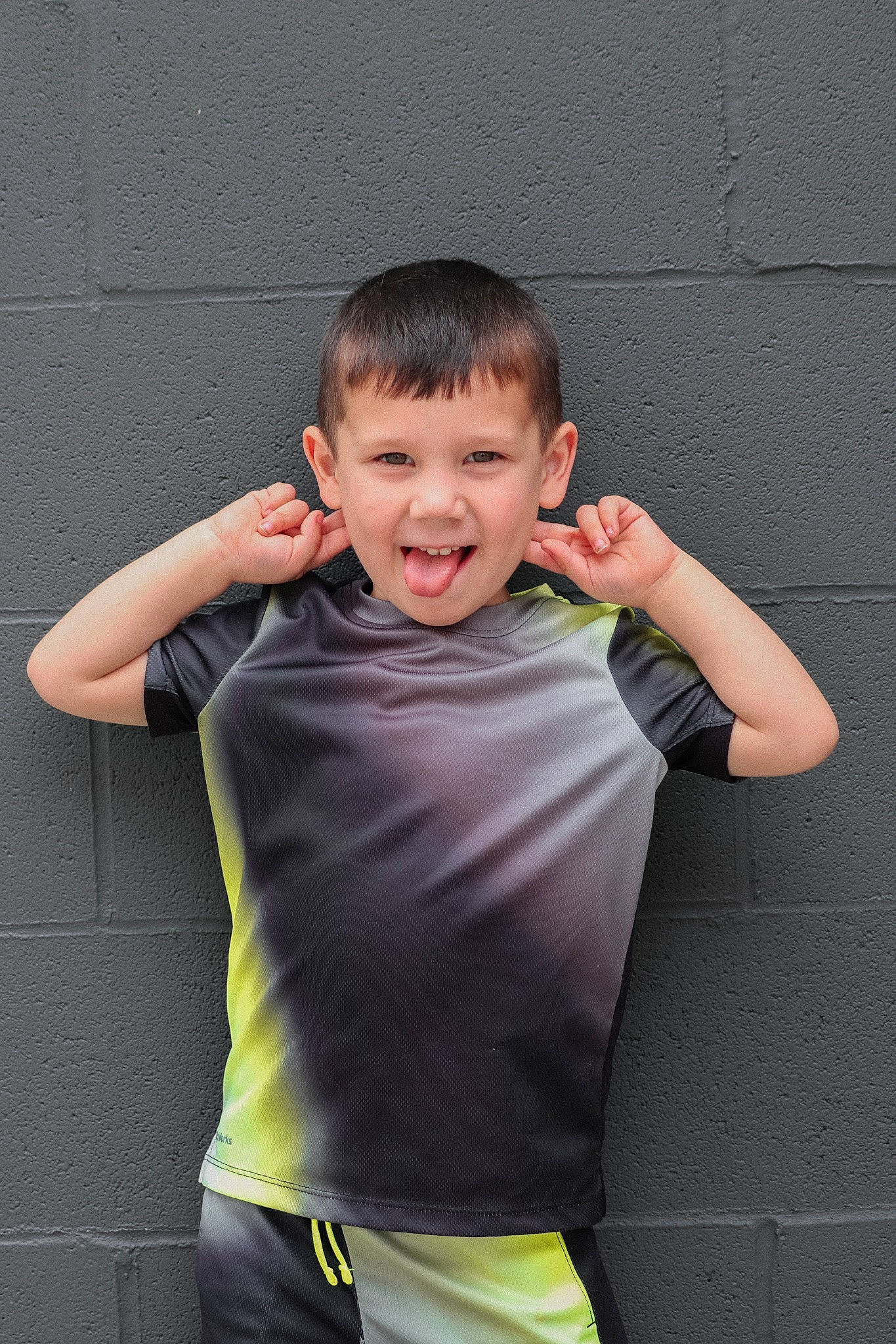 Kenzie James is registered to the contest to win money with this photo: child, child_model, elbow, finger, flash_photography, formal_wear, fun, gesture, happy, joy, leisure, person, portrait_photography, sitting, sleeve, smile, sportswear, t_shirt, thumb, toddler