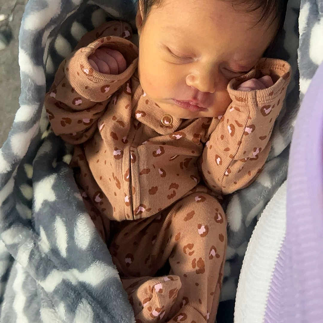 Lilyann is registered to the contest to win money with this photo: baby, bed, bedroom, blanket, clothing, cushion, face, furniture, glove, head, homedecor, indoors, newborn, pajamas, person, photography, portrait, quilt, room, sleeping