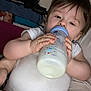 Hayden participe au concours pour gagner de l'argent avec cette photo : baby, bottle, milk, onesie, child, infant, sleepy, hand, face, person, indoor, clothing, feeding, plush, cute, resting, skin, hair, milk_bottle, casual