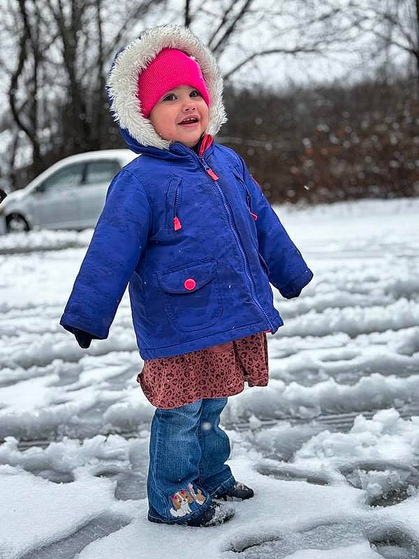 Maryjane is registered to the contest to win money with this photo: cap, child, clothing, electric_blue, face, freezing, fun, happy, headwear, human_body, jacket, leisure, outerwear, pattern, person, recreation, sleeve, smile, snow, toddler