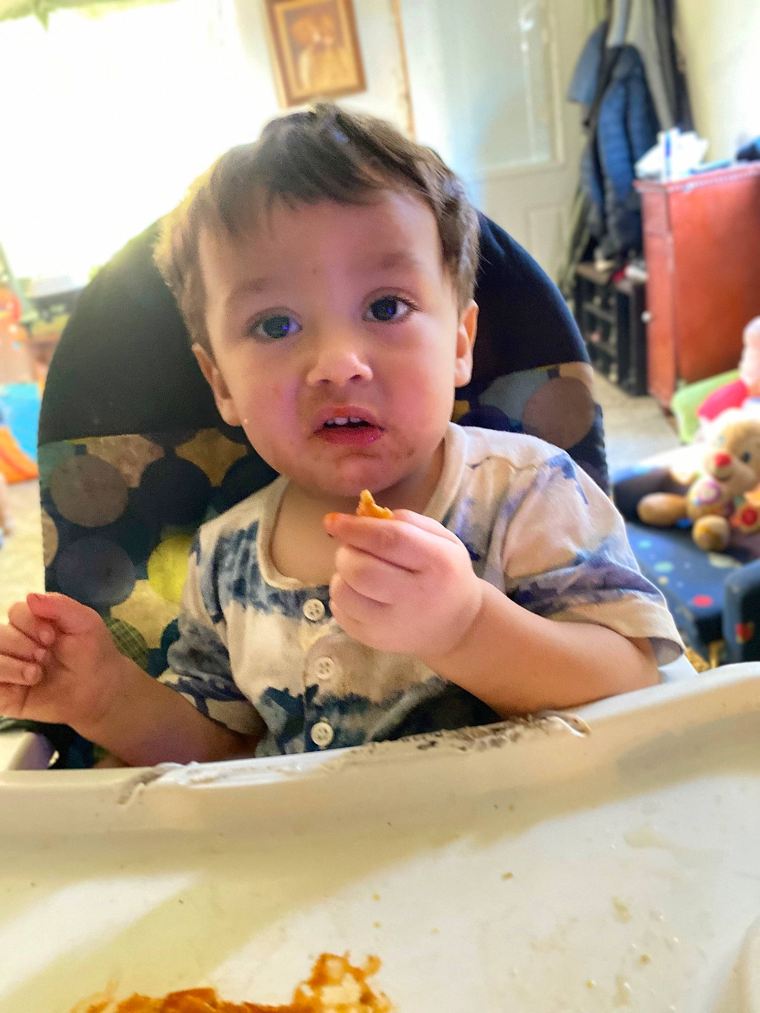 David is registered to the contest to win money with this photo: baby, breakfast, chair, child, comfort_food, cuisine, dish, eating, event, face, food, food_craving, fun, junk_food, person, plate, sharing, surprise, t_shirt, table