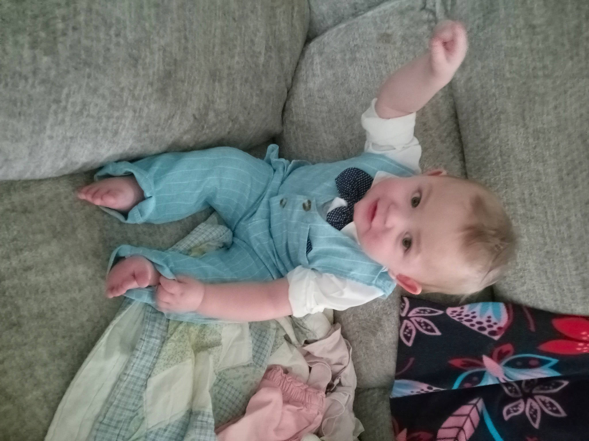 Dexter is registered to the contest to win money with this photo: baby, baby_products, baby_toddler_clothing, child, comfort, human_body, lap, linens, pattern, person, sitting, skin, sleeve, toddler, wood