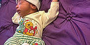 Jeremy is registered to the contest to win money with this photo: baby, baby_socks, beanie, bedtime, blanket, childrens_pajamas, christmas_theme, cozy, cute, gift_present_print, huggies_wipes, infant, left_profile_face, newborn, nursery, onesie, purple_bedspread, sleeping, striped_hat, winnie_the_pooh