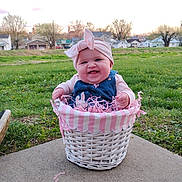 Amethyst joined the competition — help win amazing prizes! baby, basket, outdoor, grass, smiling, headband, denim, overalls, pink, white, wicker, concrete, happy, child, spring, nature, cute, person, portrait, small