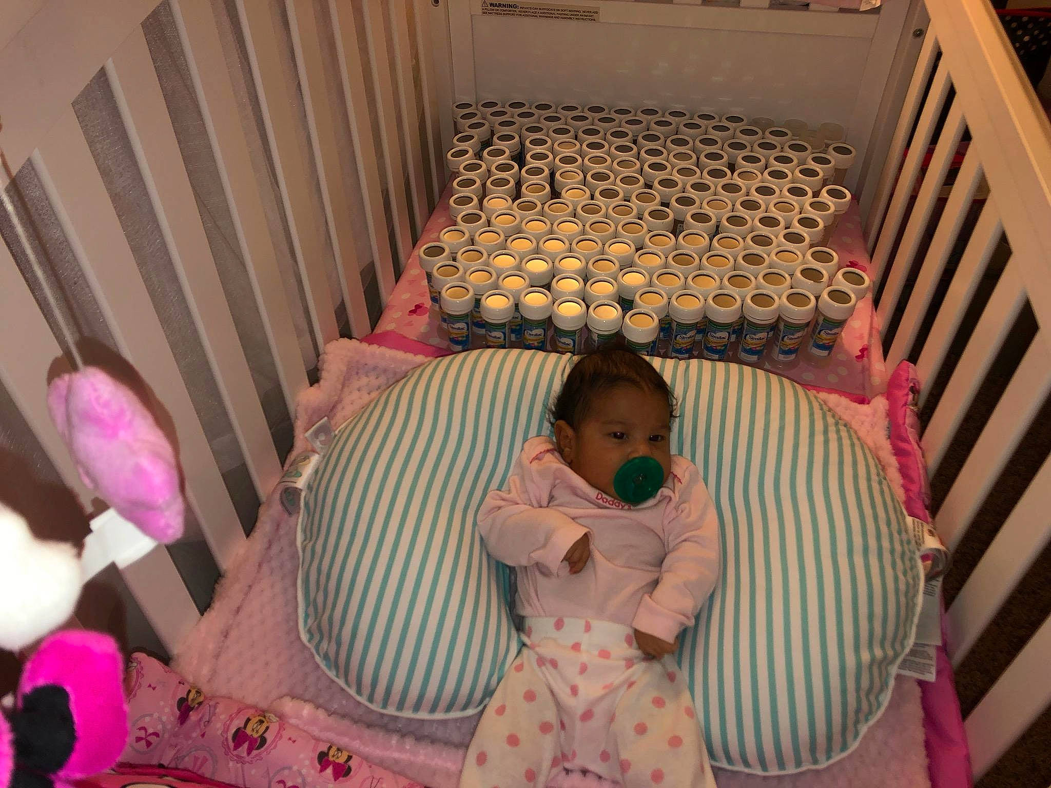 Aileen is registered to the contest to win money with this photo: baby_products, bed, child, day, fun, furniture, girl, infant, infant_bed, person, pink, product, room, skin, textile, toddler