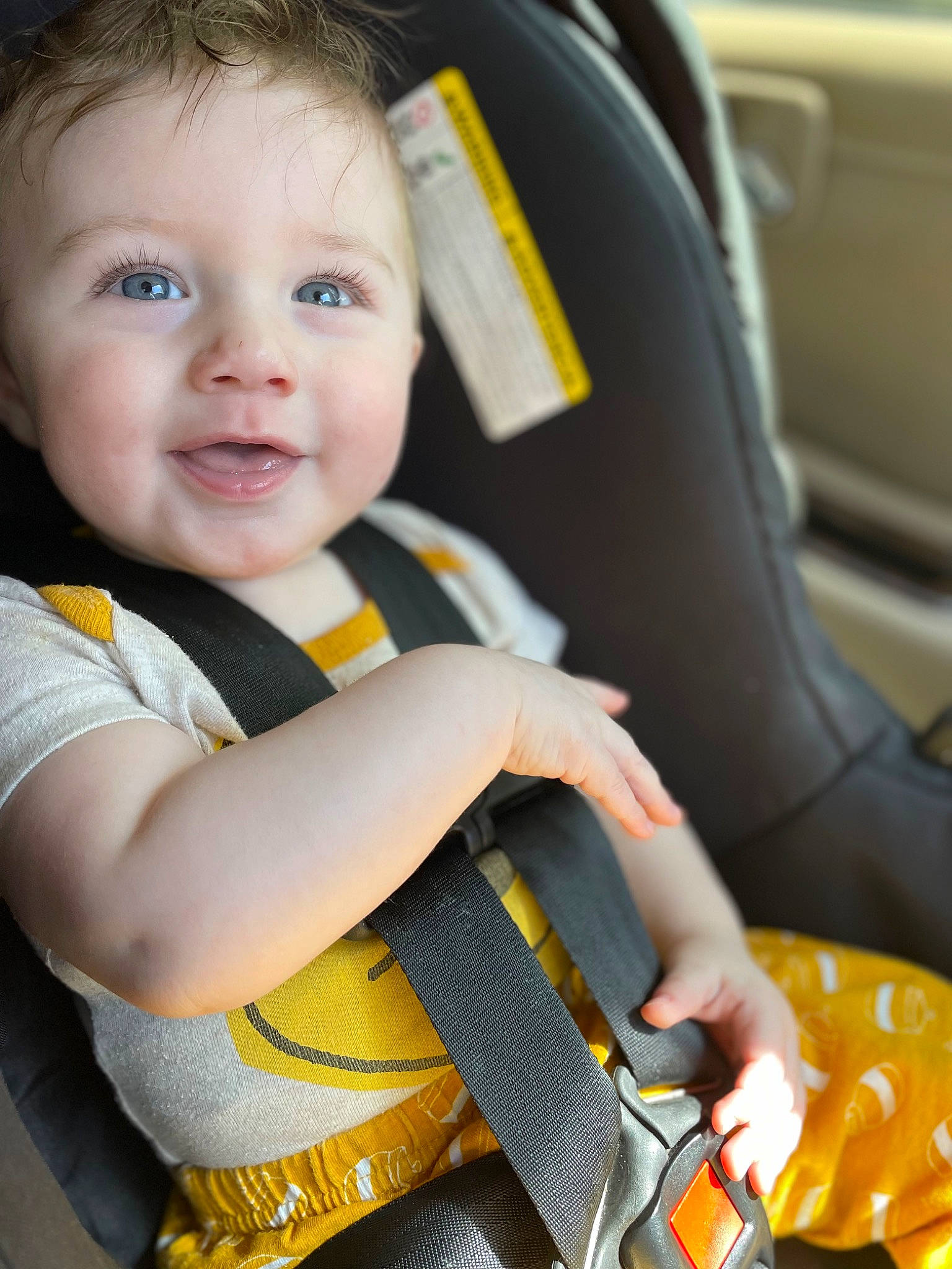 Brayden is registered to the contest to win money with this photo: auto_part, automotive_design, baby, baby_carriage, baby_products, baby_toddler_clothing, car_seat, child, comfort, finger, flash_photography, happy, head_restraint, person, seat_belt, sitting, smile, steering_wheel, toddler, vehicle_door