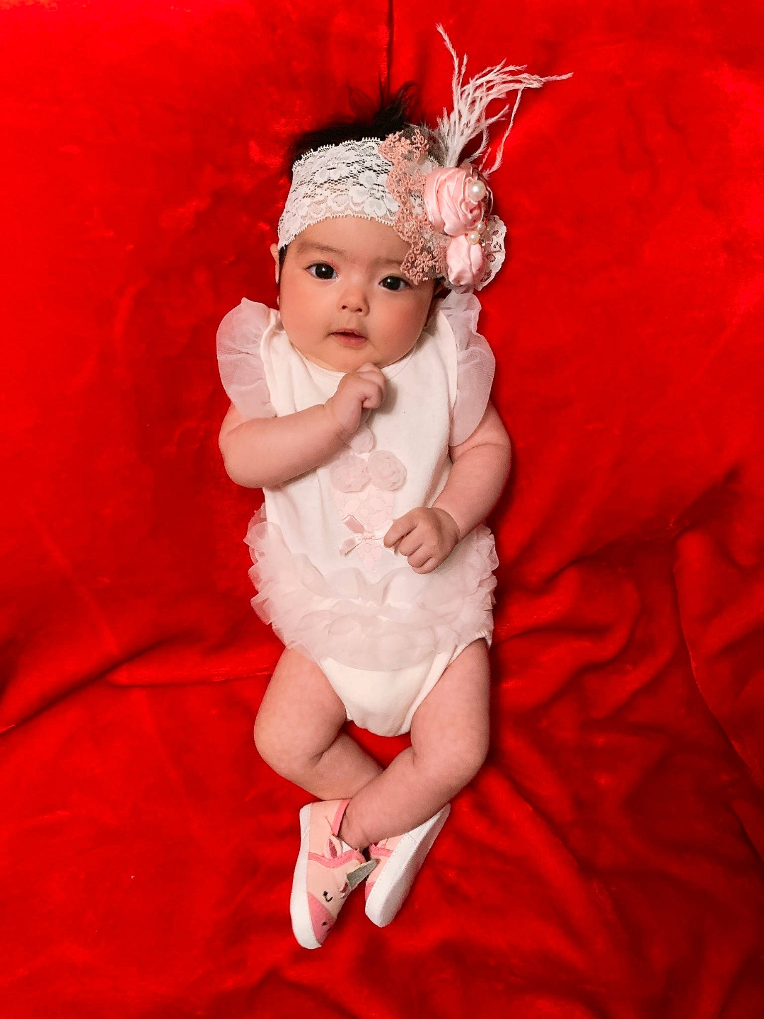 Allyson joined the competition — help win amazing prizes! arm, baby, child, child_model, fictional_character, finger, gesture, hair_accessory, hand, head, headpiece, headwear, leg, person, photography, red, smile, toddler