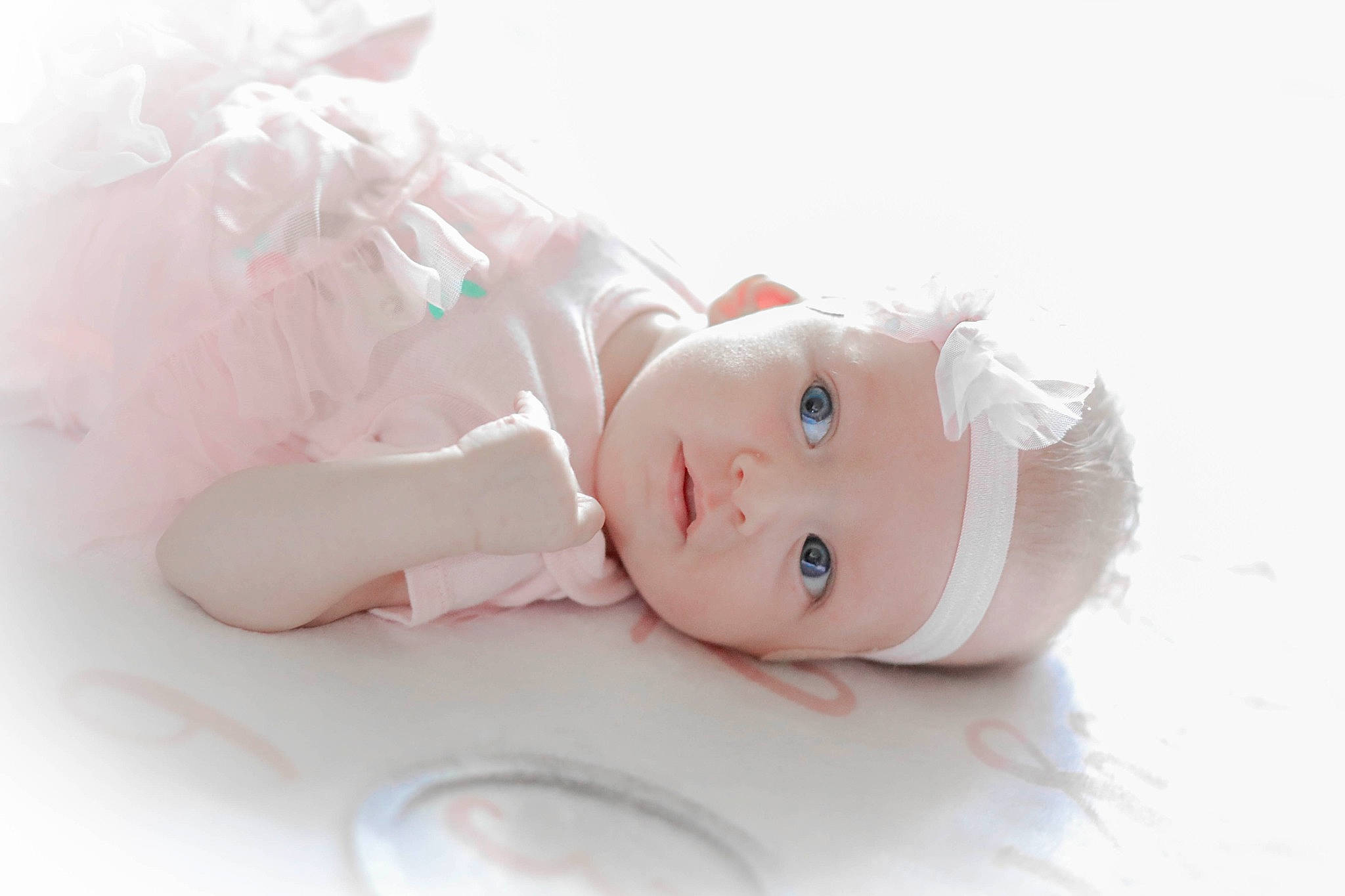 Roxann is registered to the contest to win money with this photo: arm, baby, baby_toddler_clothing, baby_toys, costume_hat, doll, dress, embellishment, eye, eyelash, fashion_accessory, figurine, fur, hair_accessory, happy, headpiece, headwear, human_body, person, portrait_photography