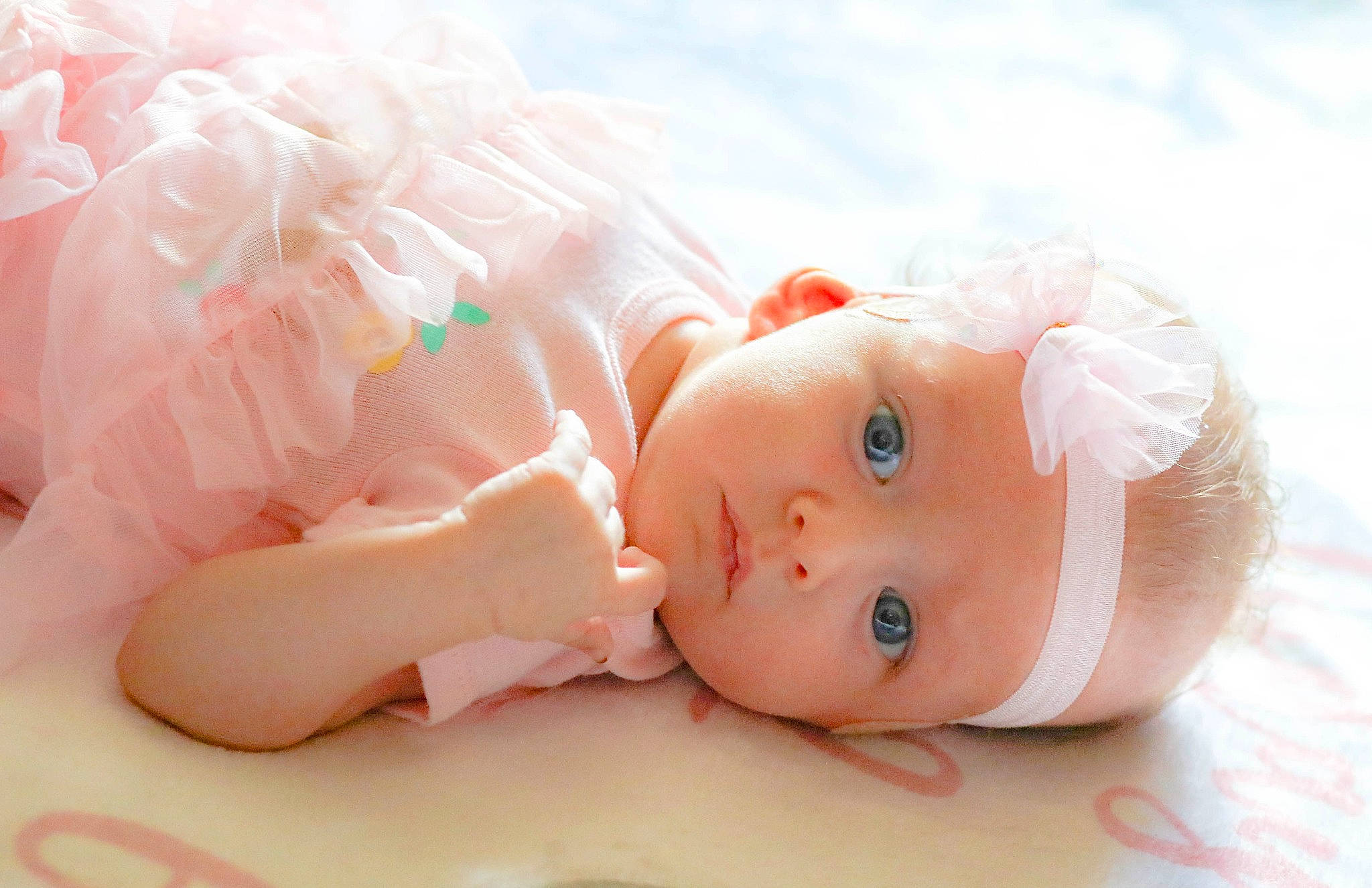 Roxann is registered to the contest to win money with this photo: baby, baby_toddler_clothing, cheek, doll, dress, eye, eyelash, fashion_accessory, hair_accessory, hat, headband, headgear, headpiece, headwear, iris, lip, peach, person, pink, skin