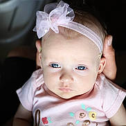 Roxann is registered to the contest to win money with this photo: baby, baby_toddler_clothing, cheek, dress, embellishment, eyebrow, eyelash, flash_photography, hair_accessory, happy, headband, headgear, headpiece, iris, jewellery, lip, pink, skin, sleeve, toddler