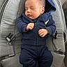 baby, infant, sleeping, hoodie, navy_blue, clothing, baby_seat, cushion, peaceful, indoor, child, toddler, cute, resting, portrait, small_hands, young, soft_texture, comfort, relaxation