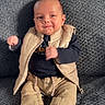 Diego participe au concours pour gagner de l'argent avec cette photo : baby, infant, smile, clothing, shoes, pants, sweater, vest, blanket, indoor, child, cute, sitting, portrait, face, person, home, cozy, happy, young