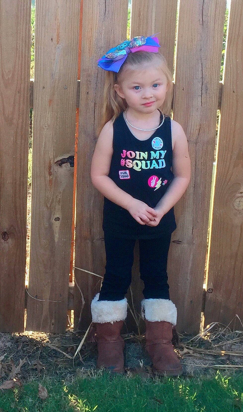 Kaycie is registered to the contest to win money with this photo: baby_toddler_clothing, black, blue, clothing, cool, eye, face, flash_photography, grass, hair, happy, head, human_body, light, people_in_nature, person, pink, skin, smile, standing