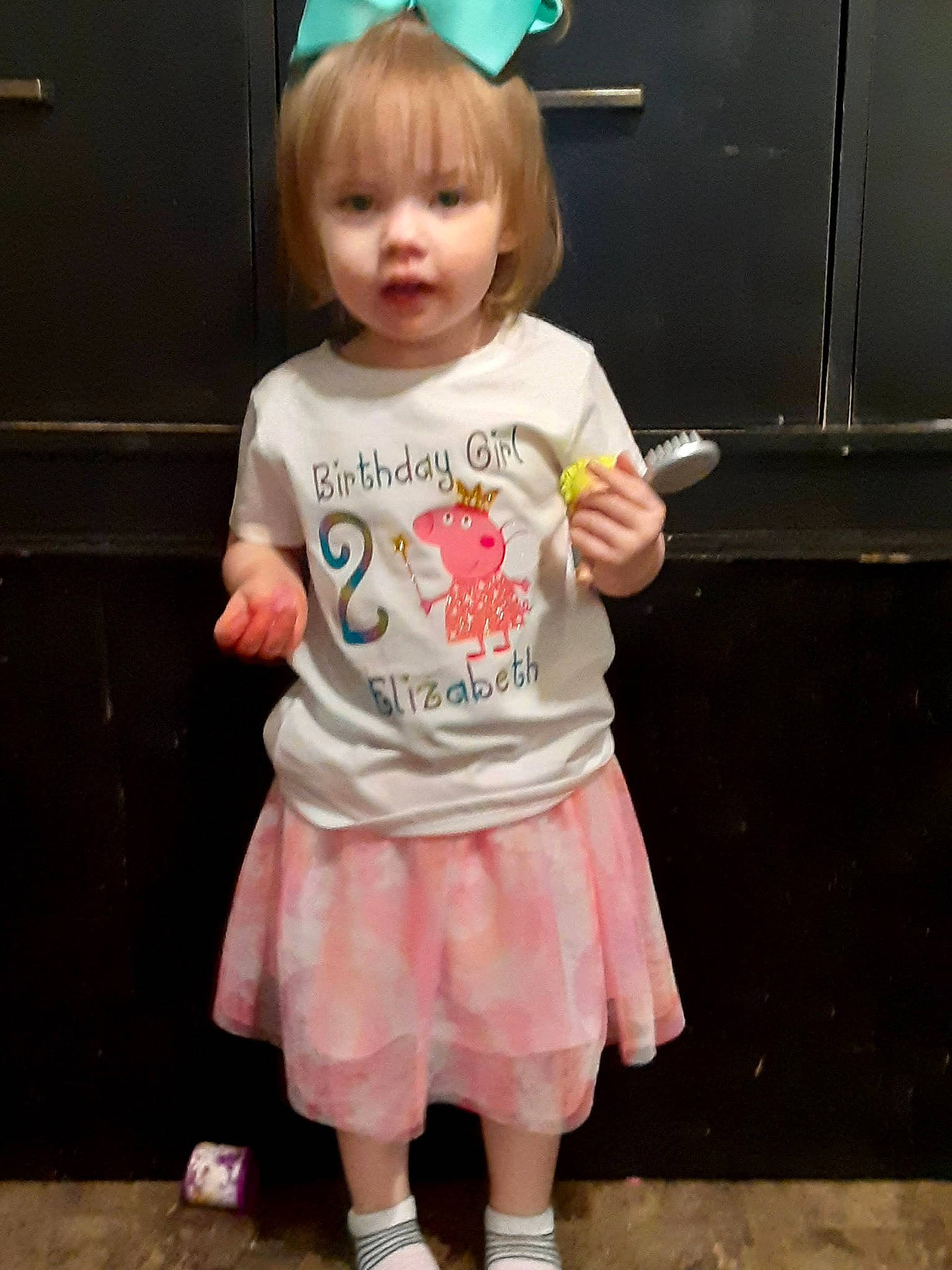 Ashlie joined the competition — help win amazing prizes! baby, baby_toddler_clothing, bangs, blond, child, clothing, costume, face, fun, happy, hime_cut, pattern, person, pink, play, sleeve, sock, standing, t_shirt, thumb