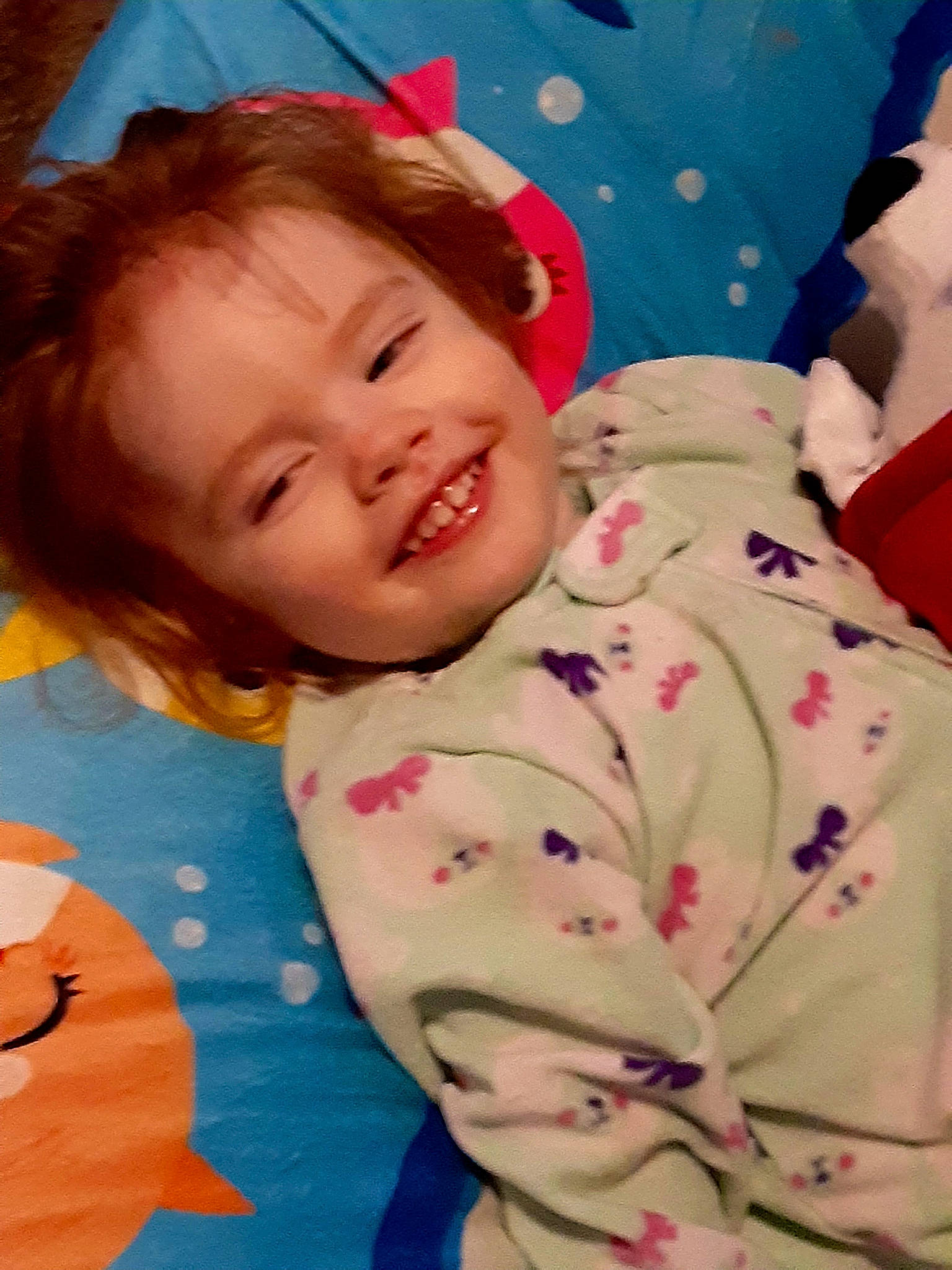 Ashlie is registered to the contest to win money with this photo: arm, baby, baby_toddler_clothing, cheek, comfort, eye, fun, happy, head, human_body, joy, linens, nose, pattern, person, pink, skin, sleeve, smile, textile