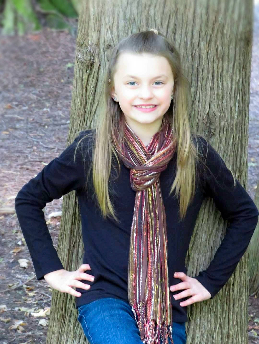 Brylee joined the competition — help win amazing prizes! brown, brown_hair, child_model, clothing, fashion_accessory, hair, hairstyle, jeans, joy, long_hair, neck, outerwear, pattern, person, photography, scarf, shawl, smile, stole, textile