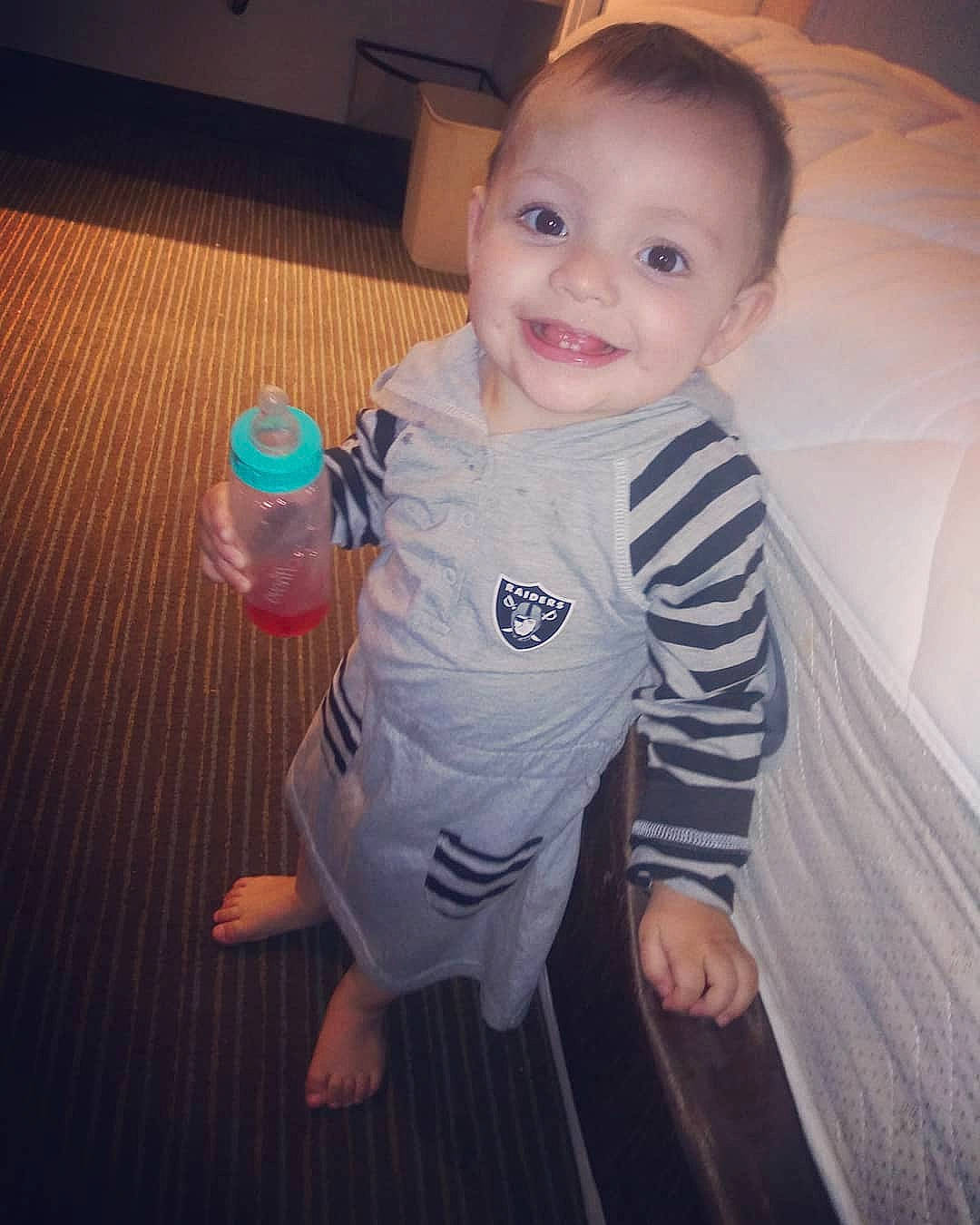 Juanita is registered to the contest to win money with this photo: baby, cheek, child, cloud, cool, electronic_device, eye, face, happy, head, iris, joy, lip, nose, person, product, skin, smile, standing, t_shirt