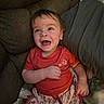 Luca joined the competition — help win amazing prizes! baby, child, smiling, happy, couch, clothing, shorts, red_shirt, indoor, face, person, cute, infant, sitting, expression, cozy, cushions, joyful, portrait, young