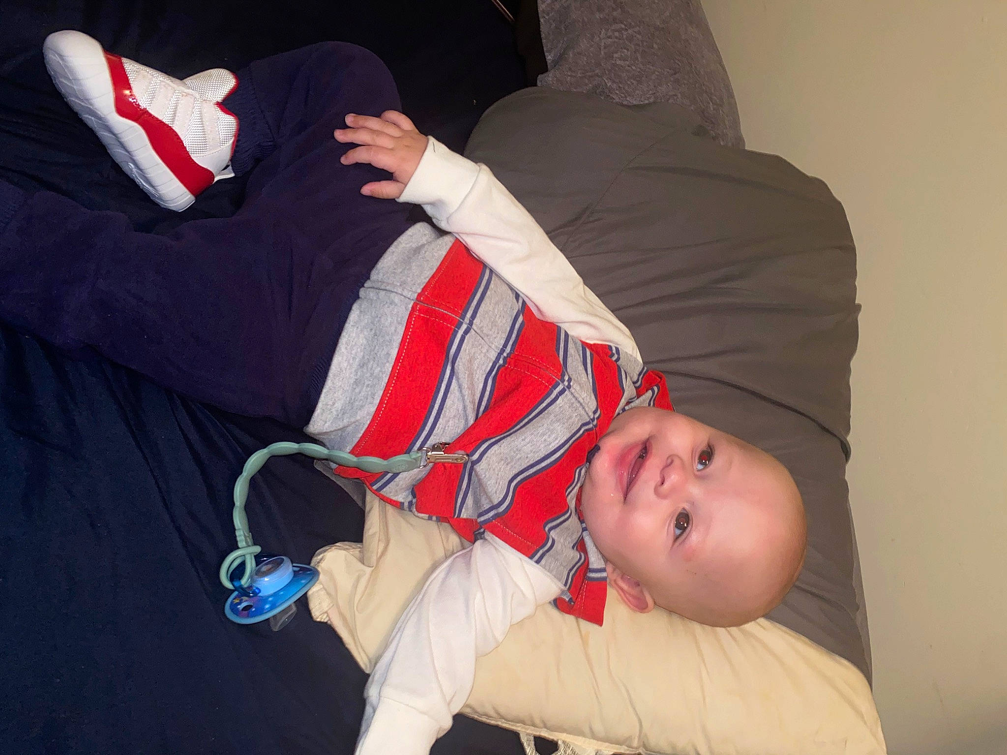 Kyrie is registered to the contest to win money with this photo: baby, baby_products, baby_toddler_clothing, carmine, child, comfort, elbow, flash_photography, fun, gesture, hat, human_leg, joy, lap, pattern, person, sitting, sleeve, thigh, toddler