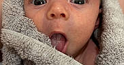 Anakin joined the competition — help win amazing prizes! adorable, baby, child, closeup, cute, expression, eyes, face, head, indoor, infant, newborn, person, portrait, skin, soft, texture, tongue, towel, wrapped