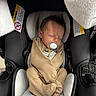newborn, baby, swaddled, car_seat, pacifier, sleeping, infant, blanket, cozy, child, young, resting, head, clothing, soft, indoors, comfort, cute, peaceful, person