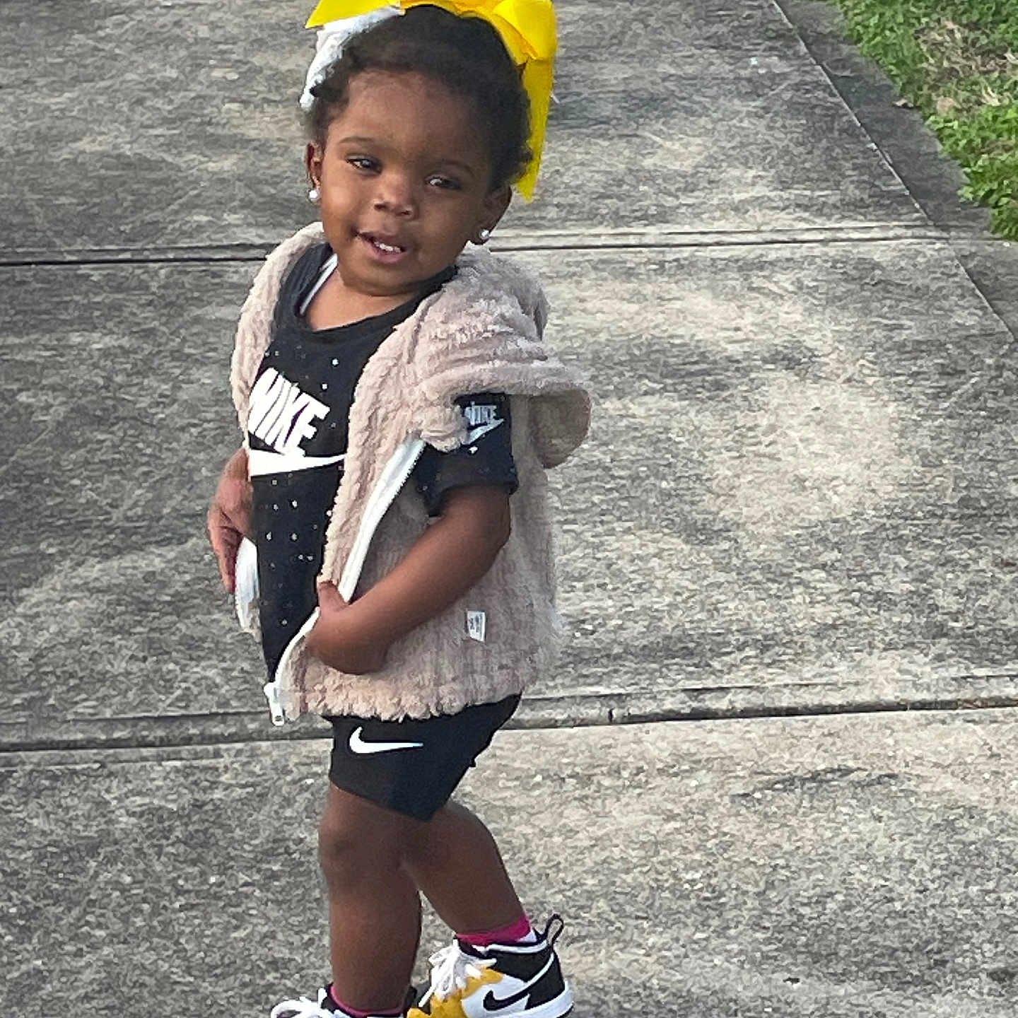 Joelle is registered to the contest to win money with this photo: ball, boy, child, clothing, face, football, footwear, head, male, path, person, photography, portrait, shoe, shorts, sneaker, soccer, soccerball, sport, walking