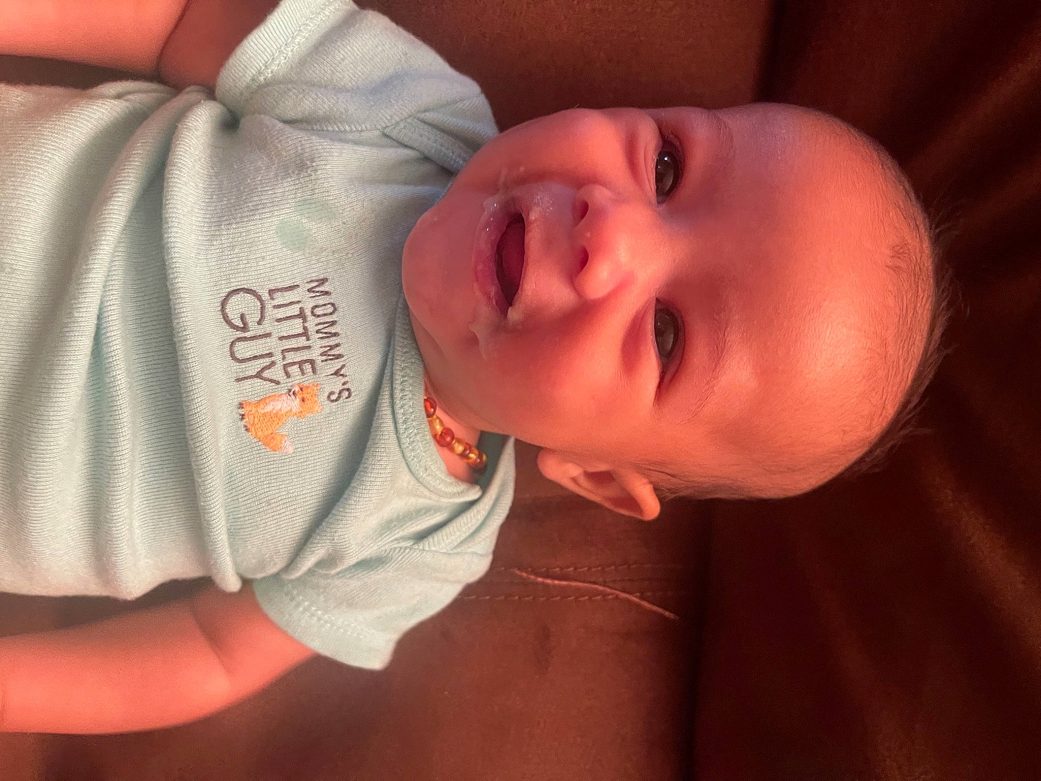 Creed is registered to the contest to win money with this photo: baby, baby_toddler_clothing, cheek, comfort, ear, eye, eyebrow, finger, flash_photography, forehead, happy, iris, lip, mouth, neck, nose, orange, person, skin, sleeve