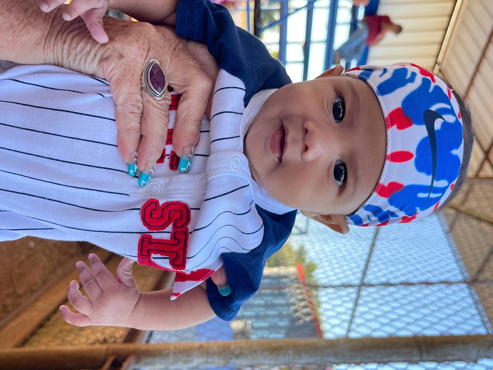 Creed joined the competition — help win amazing prizes! baby, baby_toddler_clothing, blue, child, finger, fun, gesture, happy, hat, headwear, jewellery, leisure, nail, pattern, person, plant, rose, thumb, toddler, tree