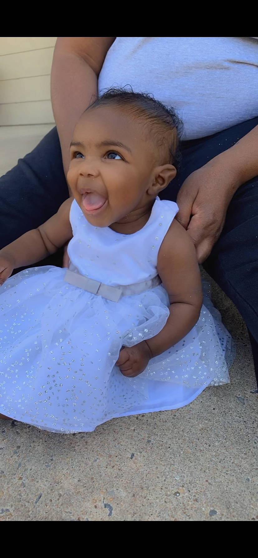 Dream is registered to the contest to win money with this photo: azure, baby, baby_toddler_clothing, cheek, child, comfort, dress, finger, fun, gesture, happy, people, person, product, sitting, skin, sleeve, smile, t_shirt, thumb