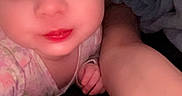 Luna is registered to the contest to win money with this photo: baby, child, person, face, glasses, smile, close_up, selfie, hand, blanket, indoor, portrait, young, cute, cozy, skin, expression, infant, baby_clothes, eyelashes