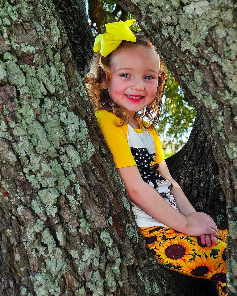 Rilynn joined the competition — help win amazing prizes! adaptation, botany, branch, eye, facial_expression, fun, hairstyle, happy, human_body, joy, leaf, nature, organ, people_in_nature, person, smile, tree, trunk, twig, vertebrate