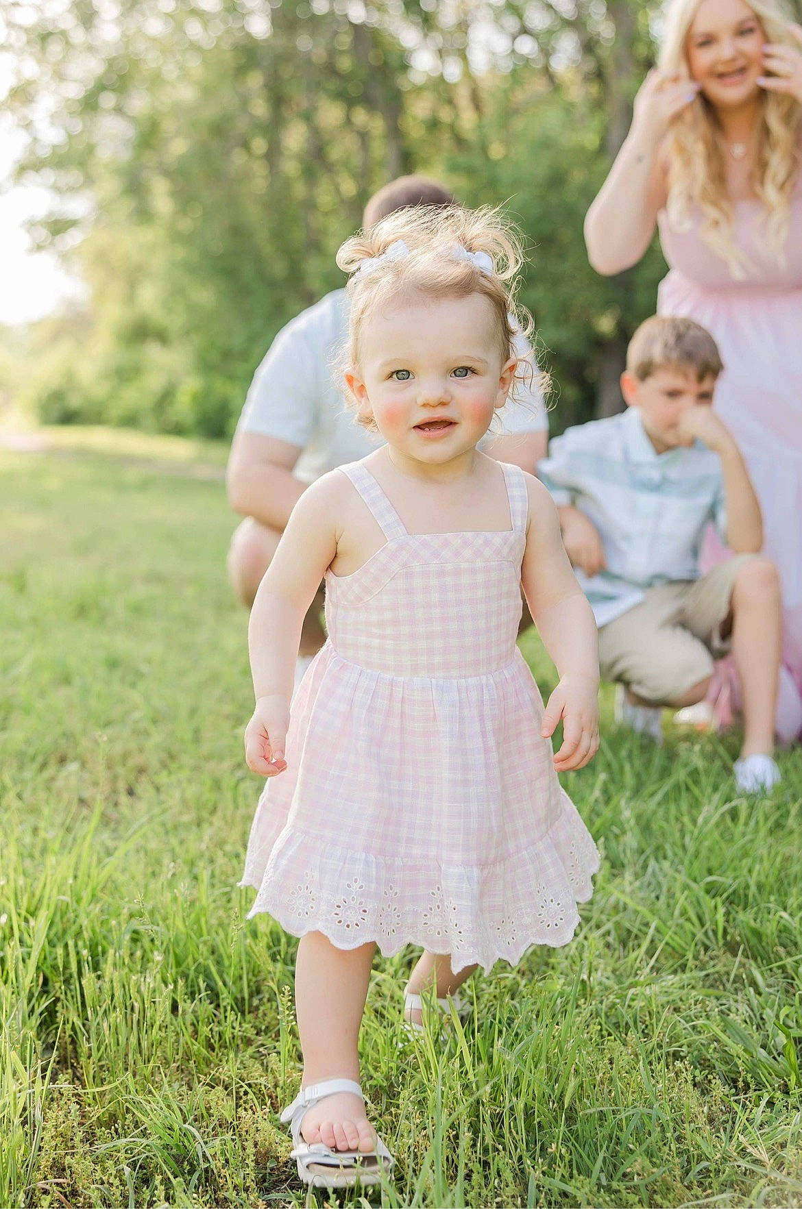 Gemma is registered to the contest to win money with this photo: baby, baby_toddler_clothing, blurred, clothing, dress, flash_photography, fun, gesture, grass, green, happy, joy, meadow, people_in_nature, person, photograph, pink, plant, skin, smile