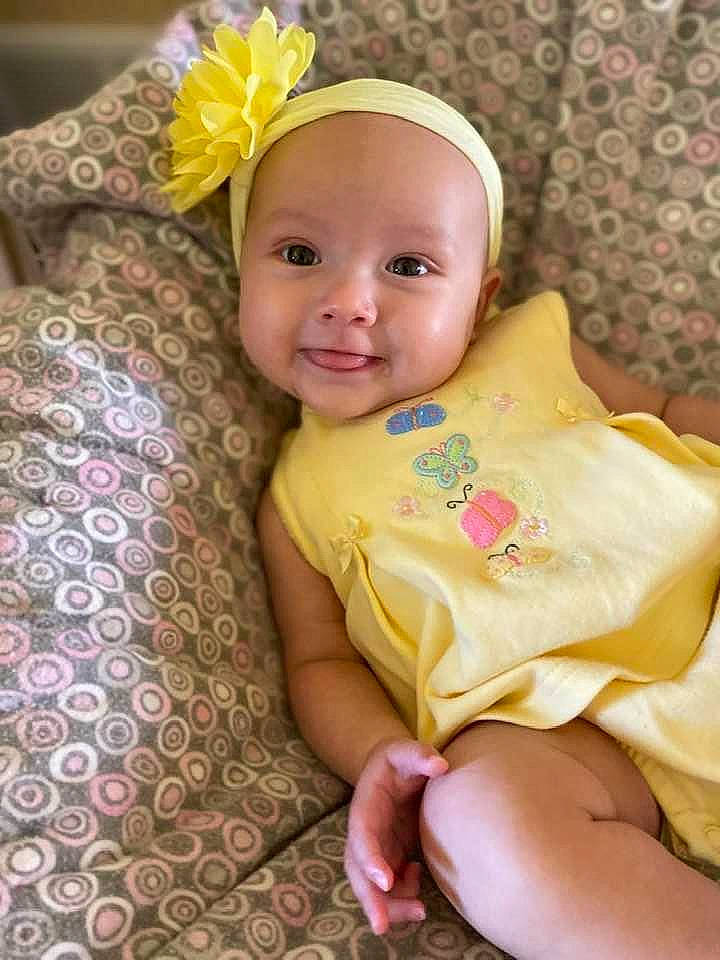 Jazzlynn is registered to the contest to win money with this photo: baby, baby_toddler_clothing, child, costume_hat, dress, event, face, finger, flower, happy, headband, headgear, headpiece, iris, joy, person, petal, pink, skin, smile