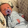 Daniel is registered to the contest to win money with this photo: baby, blue_clothing, child, clip, closeup, comfort, cute, face, hand, indoor, infant, newborn, onesie, pacifier, pattern, pillow, portrait, resting, sleepy, soft_fabric
