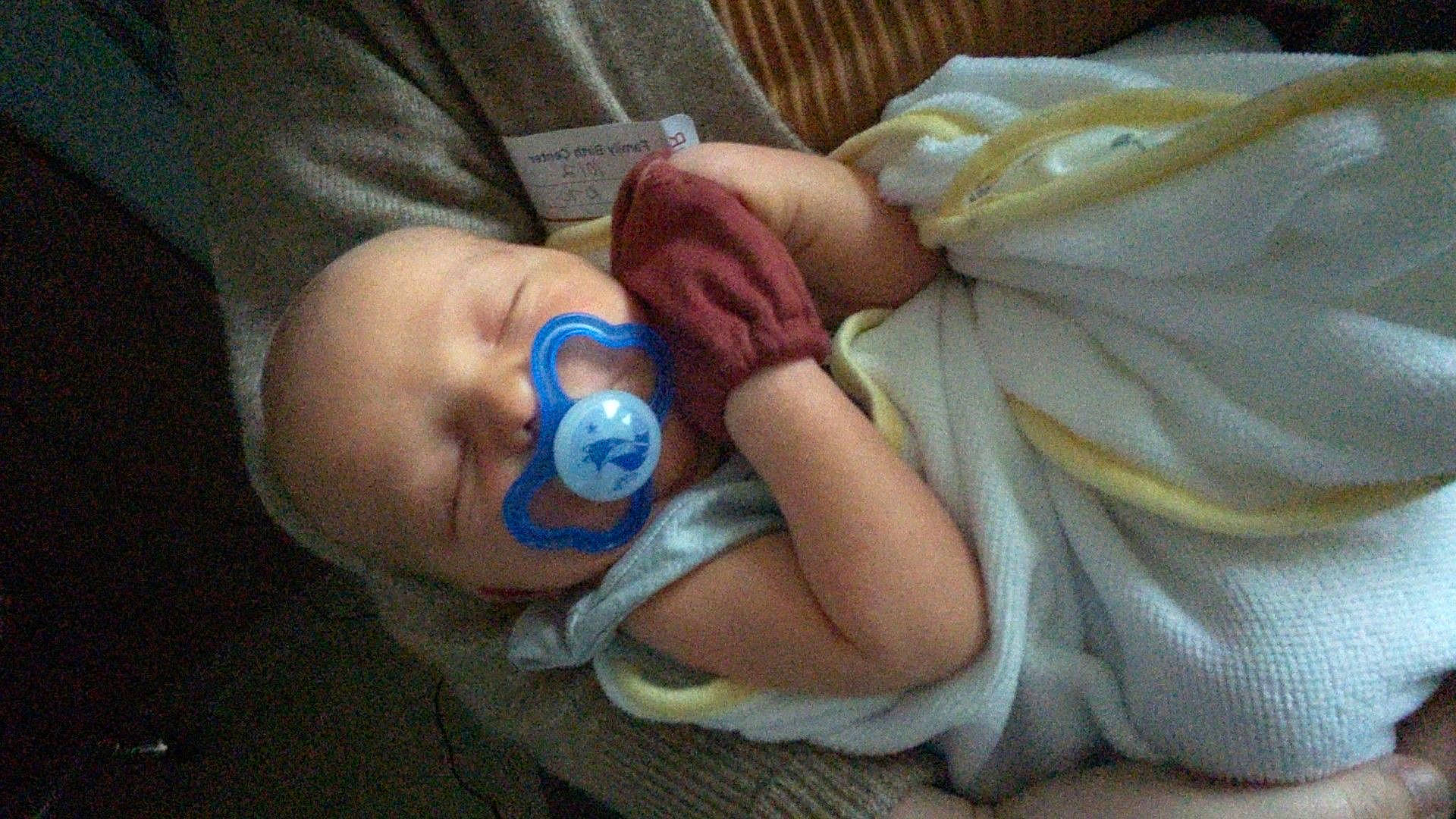 Callen is registered to the contest to win money with this photo: baby, baby_products, baby_sleeping, baby_toddler_clothing, bedtime, cheek, child, comfort, ear, finger, hand, linens, mouth, nail, person, room, sitting, skin, thumb, toddler