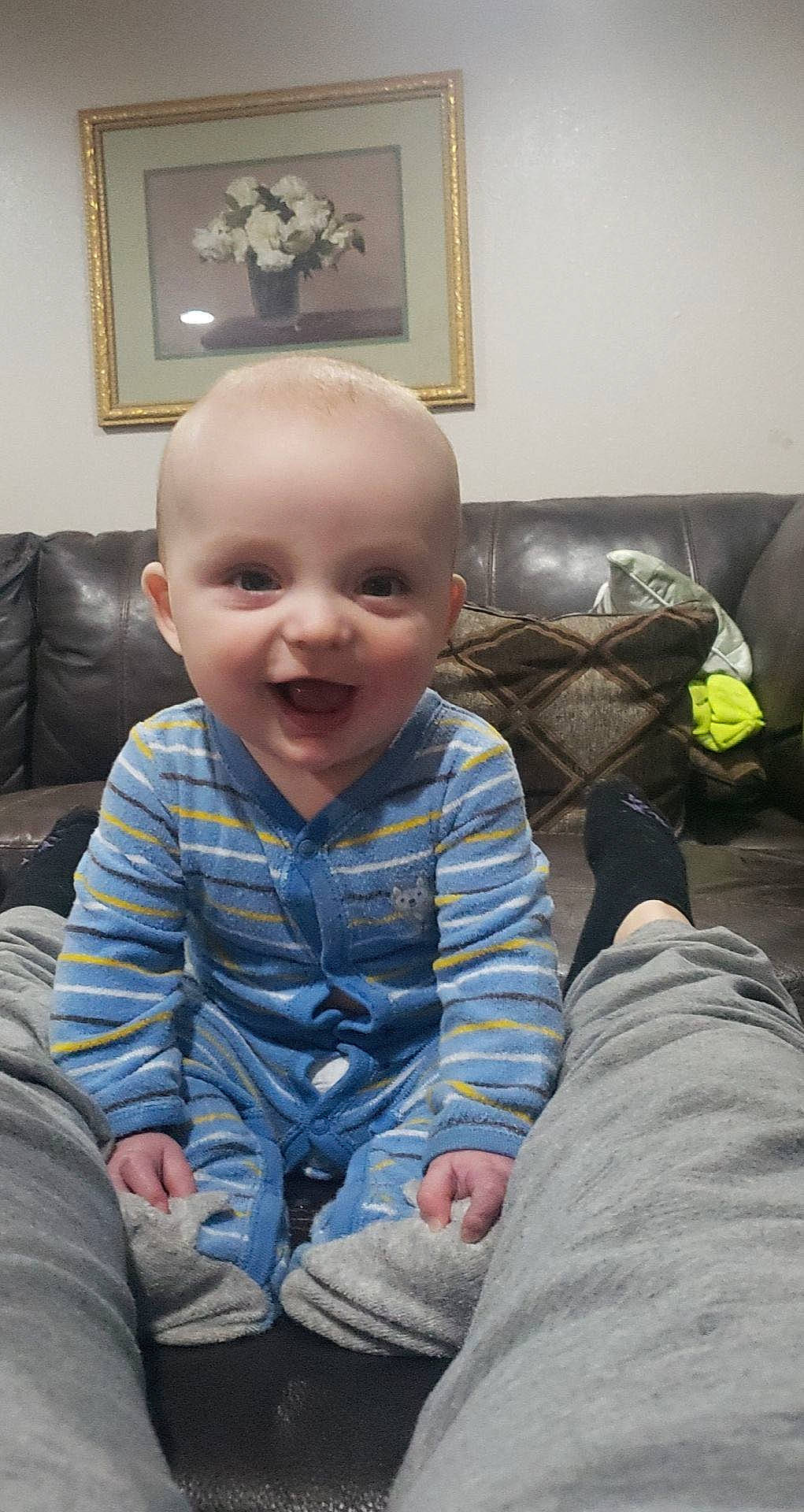 Callen joined the competition — help win amazing prizes! baby, baby_toddler_clothing, cheek, child, comfort, couch, eye, floor, flooring, happy, head, living_room, mouth, person, picture_frame, sitting, skin, sleeve, smile, toddler