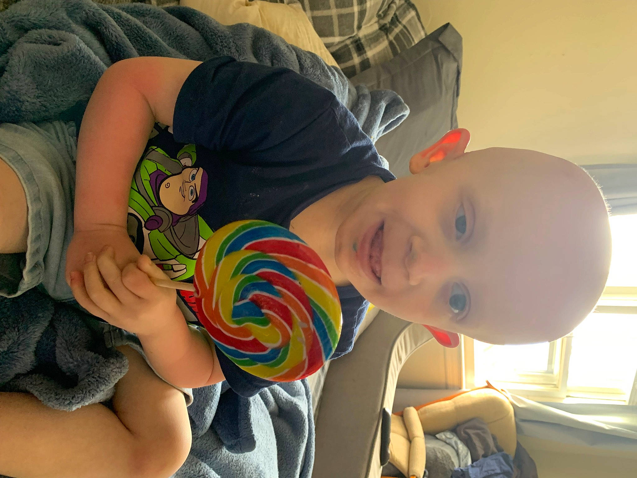 Jaxen is registered to the contest to win money with this photo: abdomen, baby_products, chest, child, comfort, elbow, finger, fun, happy, head, human_body, human_leg, joint, mouth, nail, person, play, thigh, toddler, toy