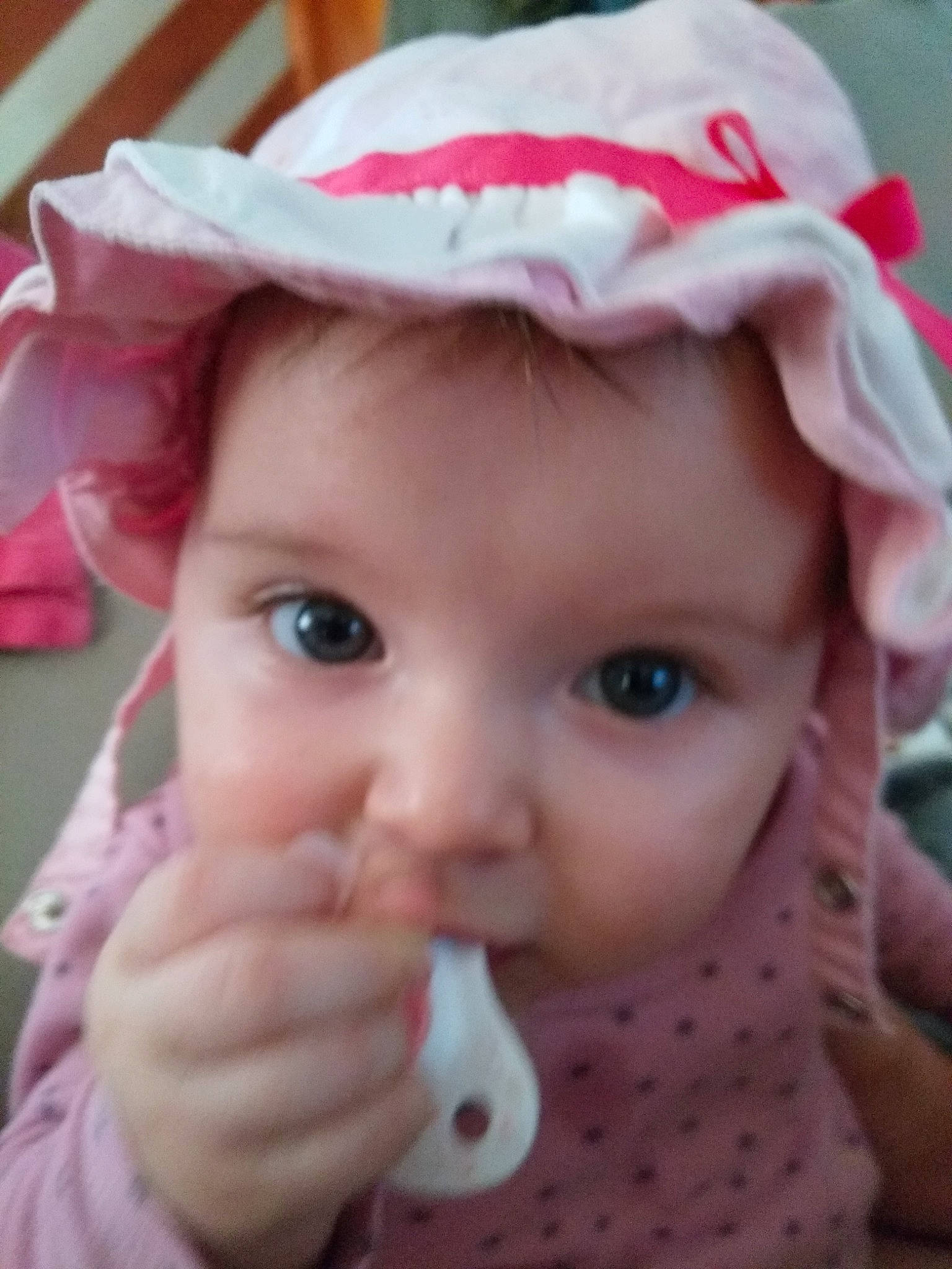 June a rejoint le concours — aidez-le/la à gagner de superbes lots ! baby, bonnet, cheek, child, ear, eye, face, headgear, lip, mouth, nose, person, pink, skin, smile, toddler