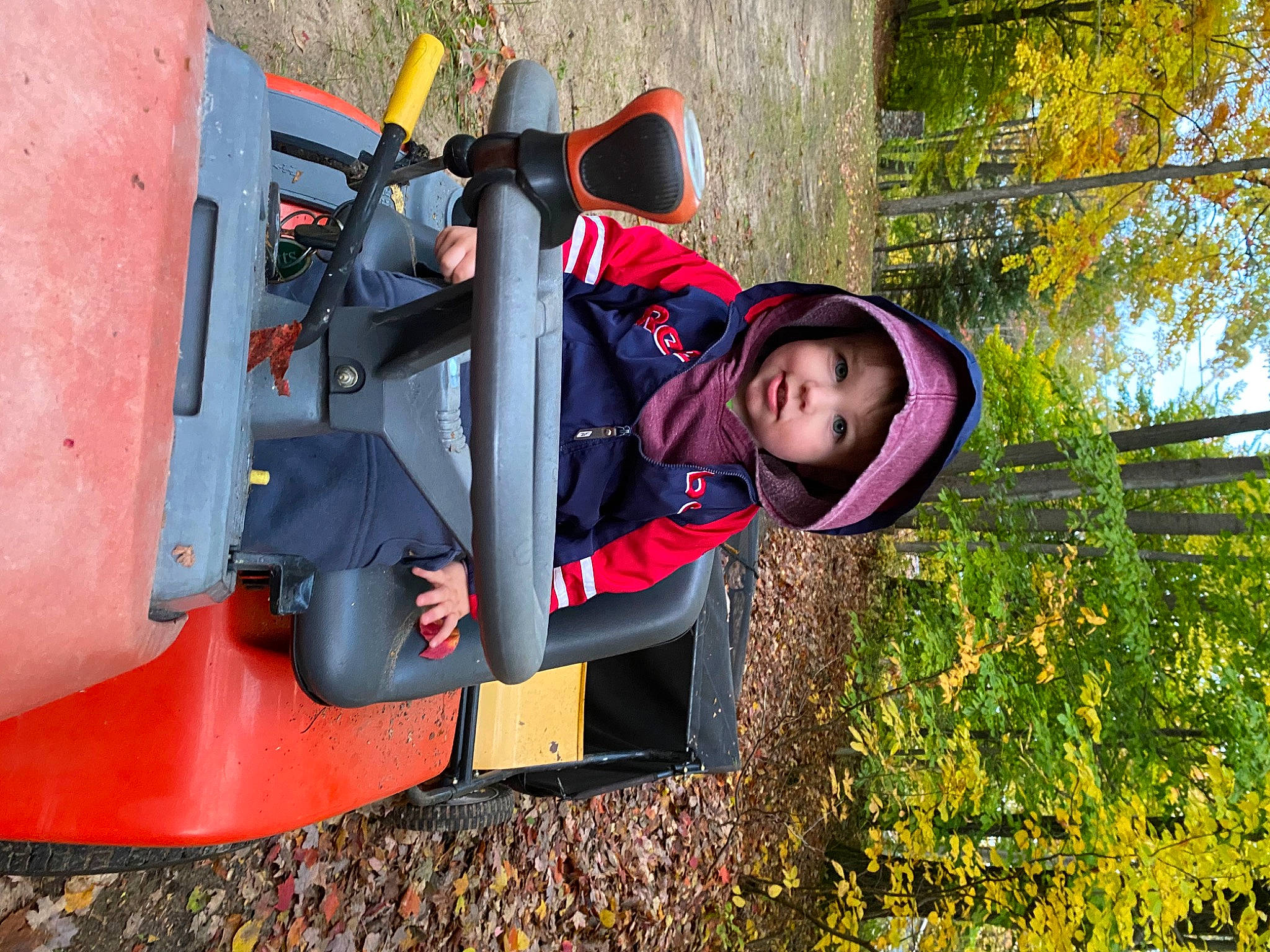 Zander joined the competition — help win amazing prizes! adventure, automotive_exterior, bumper, carmine, fun, grass, headwear, helmet, jacket, leisure, people_in_nature, person, personal_protective_equipment, plant, play, recreation, smile, toddler, tree