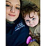 Iris joined the competition — help win amazing prizes! blue_eyes, candid, casual, child, closeup, cozy, curly_hair, face, family, hair, hoodie, indoor, laying_down, plush_toy, portrait, septum_piercing, smile, tattoo, toddler, woman