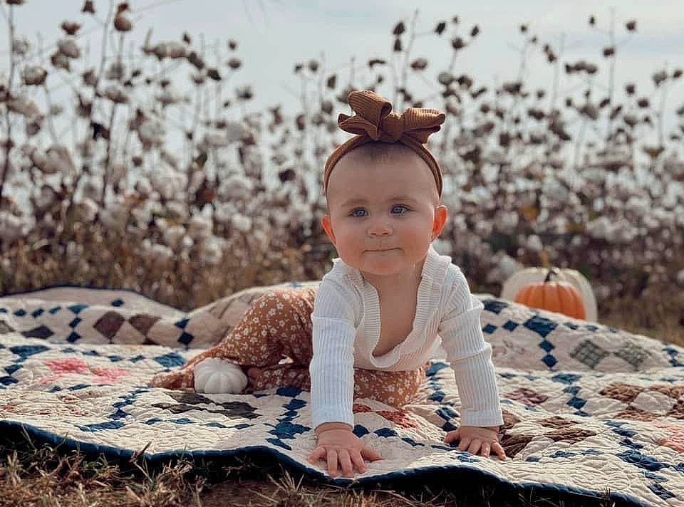 Sadie joined the competition — help win amazing prizes! baby, baby_toddler_clothing, brown_hair, doll, fashion_accessory, fawn, flash_photography, fur, grass, happy, headband, headpiece, joy, pattern, people_in_nature, person, sitting, sky, smile, toddler